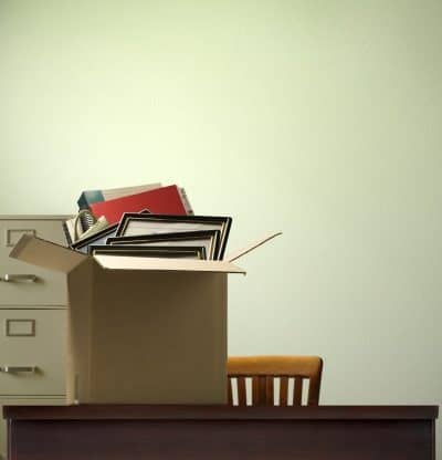 Career coaching - image of belongings packed in a box on a desk
